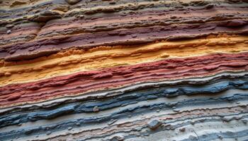 layers of colored minerals exposed on a cliff face. photo