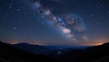 a star filled night sky above a silent valley. photo