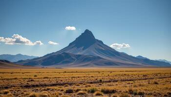 a single mountain rising from an empty plain. photo