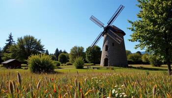 old windmill turning slowly in a warm summer breeze photo