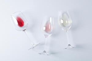 Flat lay. Glasses with different wine on grey background, copy space photo