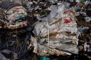 Plastic waste and garbage remain piled at a landfill site, highlighting the severe pollution and challenges in waste management photo