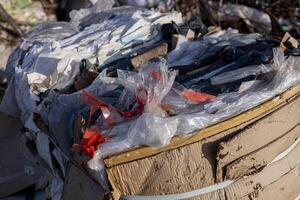 Collected plastic and debris are piled at a landfill, highlighting ongoing pollution and the urgent need for effective waste management solutions photo