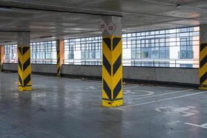 A well-structured parking garage showcases its spaciousness with marked spots and tall columns designed for maximum safety and efficiency photo