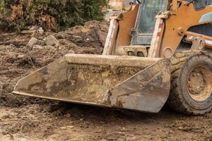 Heavy machinery is actively digging at a construction site, demonstrating the vital work of engineers in the construction industry photo