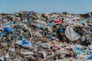 Mountains of plastic and debris litter the landfill, showcasing the growing problem of pollution and the need for environmental action photo