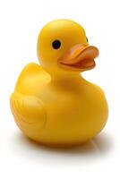 Cute little yellow rubber duck placed against plain white backdrop, symbolizing fun, cleanliness and simplicity photo