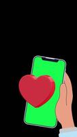 4K animation of a hand holding a smartphone with green screen, showing a beating heart icon on screen, all set against a neutral black background. Ideal for love or tech themes. video