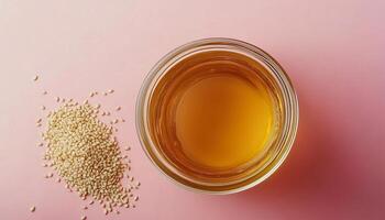 Sesame oil natural organic extract seed for cooking on glass jar photo