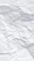 Crumpled paper stop motion animation, Textured paper vertical background. The concept of sketch pad, design, retro style, wrinkle, frayed, blank video