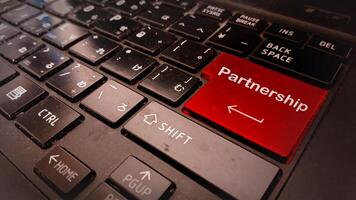 The partnership key on a laptop keyboard photo