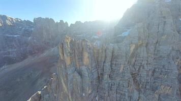 FPV drone flying close to the sharp mountain cliffs and Lago di Sorapis. Italy video