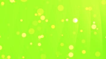 Yellow bokeh lights on a bright green background, suitable for festive designs, party invitations, and vibrant summerthemed projects. video