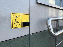 Close up of an accessibility alert system with Braille and iconography, combining tactile and electronic technologies to enhance safety and independence photo