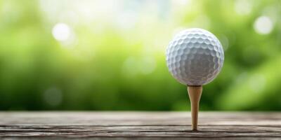 The golf ball resting on a wooden tee against a serene blurred background. photo