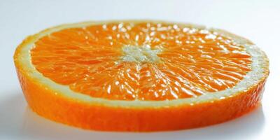 The close-up view of a vibrant orange fruit slice on a white background. photo