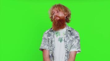 Young Caucasian man tired bored indifferent expression, exhausted of tedious story, not interested in communication talk, displeasure, uninteresting. Guy isolated on chroma key background indoors video