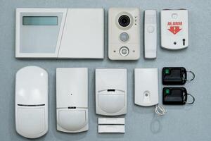 set of security systems for the house on a gray background close-up. photo