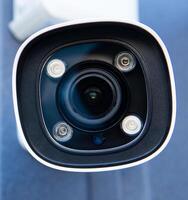 CCTV surveillance camera in factory area to control security system area with torch light and copy space photo