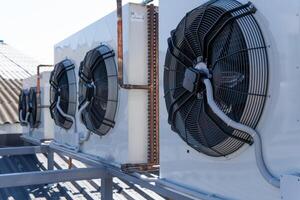 The air conditioning system is assembled on the side of the building. photo