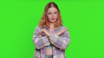Stop, enough. Caucasian woman say no hold palm folded crossed hands in finish gesture, warning of finish, prohibited access, declining communication body language danger. Girl on chroma key background video