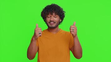 Great work, nice. Proud indian man applauds and nodding in approval, successful good great job. Celebrating success winning. Hindu guy shocked by sudden victory isolated on green chroma key background video