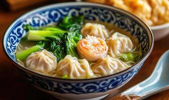 a bowl of soup with dumplings and broccoli photo