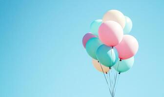 A bunch of colorful balloons floating in the sky photo
