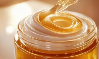 A jar of cream with a swirl of honey on top photo