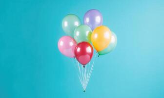 A bunch of balloons are floating in the air above a blue background photo