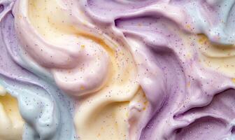 A swirl of frosting with a purple and yellow center photo