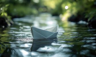 paper boat floating in water with trees in background photo