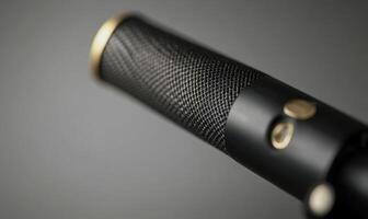 A microphone with a gold and black design photo