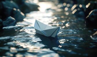 a paper boat floating in a river photo