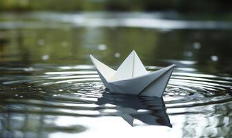 A paper boat is floating in a body of water photo