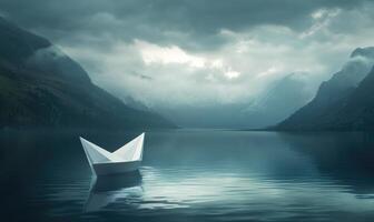 A paper boat is floating on a lake in the mountains photo