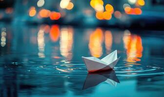 A white paper boat floating on the water photo