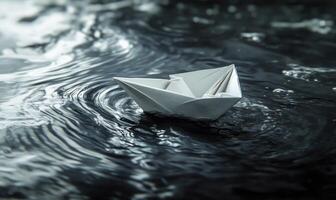 A paper boat is floating on the water closeup photo