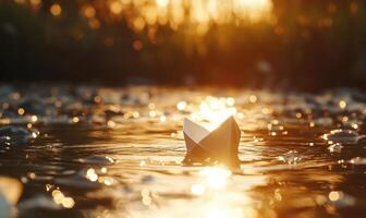 A paper boat is floating on a river photo