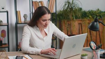 Irritated tired Caucasian business woman while working on laptop, unexpected online website problem, computer virus data loss by hacking. Freelancer feeling mad, broken notebook at office workplace video