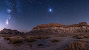 Night Sky over Desert Canyon Landscape with Milky Way and Stars. A breathtaking panoramic view of a desert landscape under a stunning night sky. photo