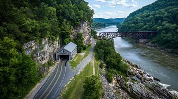 Scenic Aerial View of a River Valley with a Historic Railroad Bridge and Tunnel. photo