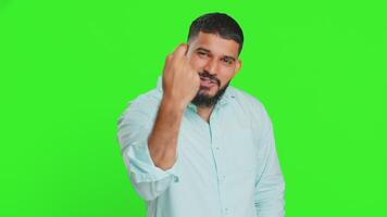 Knock-knock who is there. Confused excited Indian man knocking door gesture asking who is at home, feeling embarrassed, no idea, being clueless and uncertain. Guy isolated on chroma key background video