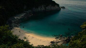 Secluded Cove Aerial View of a Pristine Beach Nestled Between Lush Green Cliffs. photo