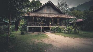 Rustic Wooden House in Lush Tropical Foliage. A quaint dwelling nestled amongst vibrant greenery, showcasing traditional architecture. photo