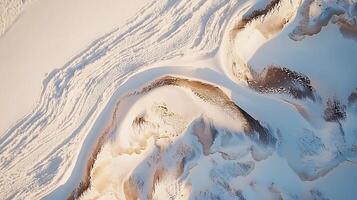Aerial View of a Snow Covered Landscape with Unique Textures and Patterns. A Stunning Abstract Image of Winter Scenery. photo