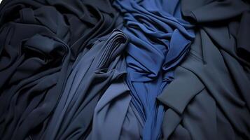 Abstract Draped Fabric Shades of Blue and Black. A close up image of luxurious textile material in a variety of dark blue and black hues. photo
