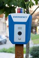 SOS, police, emergency button in the public park. photo