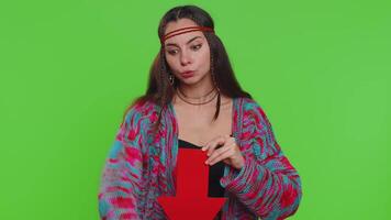 Upset woman showing red arrow pointing down, concept of downgrade, unsuccessful business, fall of stock market money exchange rate bankruptcy fail. Girl isolated on chroma key background, green screen video