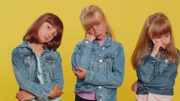 Bored teenage girls exhausted of tedious story, not interested in communication talk, displeasure, uninteresting. Little children sisters tired indifferent expression. Frustrated three siblings kids video